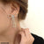 CEDH243 SGC Bow Tear drop Earrings