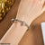TBRH116 ZXS V-Shaped Hand Bracelet
